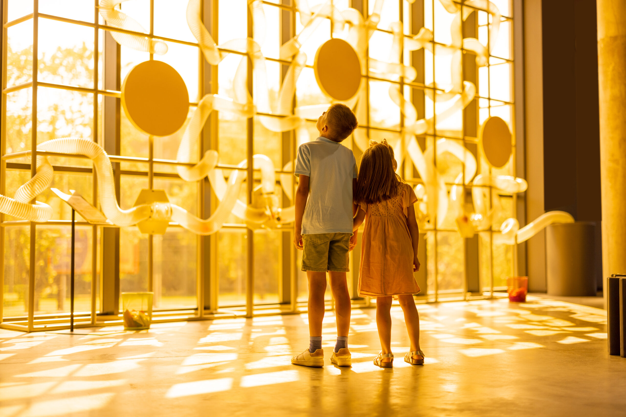 Children exploring a museum exhibit together